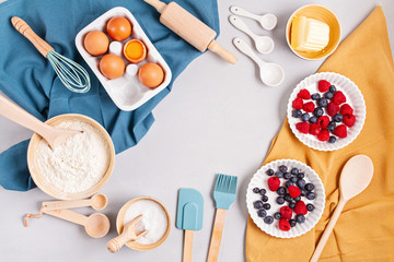 Rustic baking ingredients and kitchen utensils. Homemade pastry, baking. Top view flat lay background. Copy space. Healthy fresh organic food.