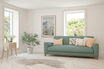 Fototapeta premium Stylish room in white color with sofa and summer landscape in window. Scandinavian interior design. 3D illustration