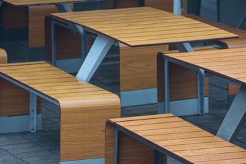 Empty wet tables in a cafe. Furniture for a bistro.