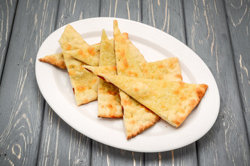 pita bread on wooden board