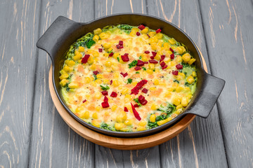 healthy diet. Casserole with potatoes, corn, green peas and spinach and cheese