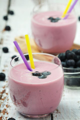 Two glasses with blueberry yogurt	