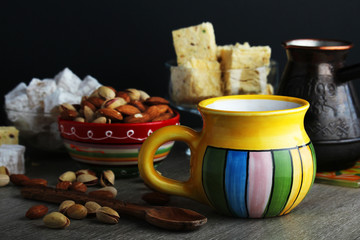 Different oriental sweets: turkish delight, halva, almond and pistachio	