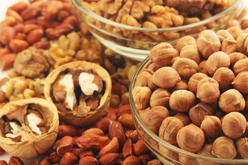 Different nuts in glass cups