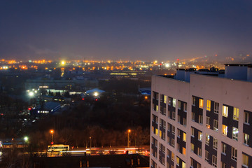 Evening arial view of a high-rise modern building with flickerin