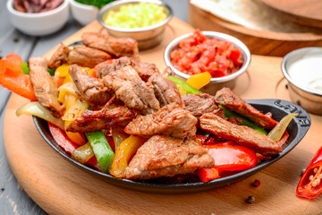 Fried meat with different vegetables with sauce