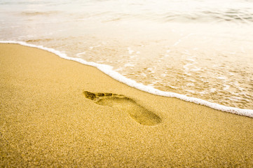 Footprint on the beach in Santo Tomas, Menorca - Spain
