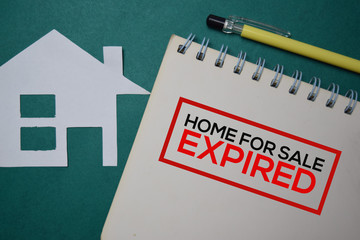 Home For Sale Expired write on a book isolated on green background.
