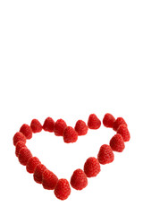 Ripe raspberries lying in a heart shape isolated in white