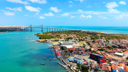 Naklejka na ściany i meble Suspension Bridge in Natal, Brazil and colorful blue water of Atlantic ocean. 