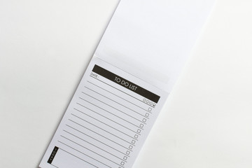 Blank opened to do list pocket planner with checklist for checkmarks isolated on white background