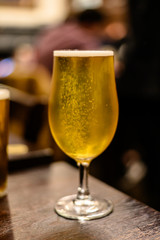 Misty glass with pint of cold Scotch ale, pale ale draft beer in English pub