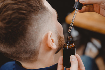 Oil for stimulating beard hair growth for men, care and restoration structure barbershop
