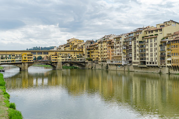 Fototapeta na wymiar Ponte Vecchio bridge across Arno river in Florence