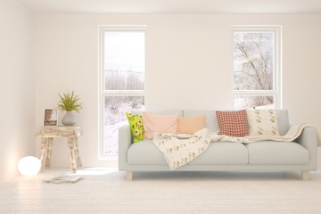 Stylish room in white color with sofa and winter landscape in window. Scandinavian interior design. 3D illustration