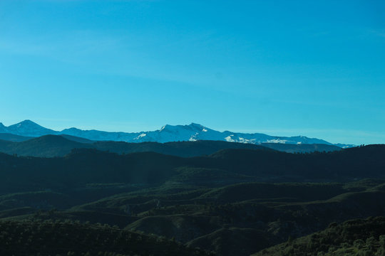 Breathtaking View To The Snow Peaks Of Sierra Nevada Mountains And Green Valley Below, Granada, Spain