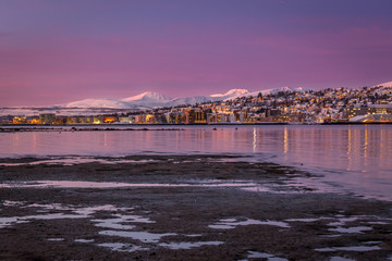 Amazing sunrise with amazing magenta color over Tromso, Norway. Polar night. long shutter speed