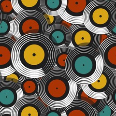 Seamless pattern in retro style with vinyl records of yellow, blue and red colors.