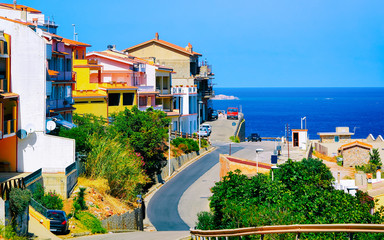 Street Cityscape of car road at Buggerru city at the Mediterranean Sea in South Sardinia in Italy....