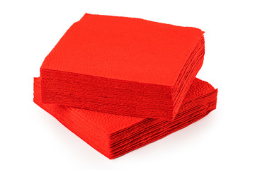 stack of clean red paper napkins on a white background.