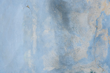 Aged blue street wall background. Textured soft blue wall