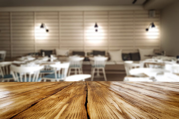 desk of free space and blurred bar interior 