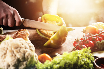 Chef at work with vegetables. Concept of genuine food. Pepper, nutrition.