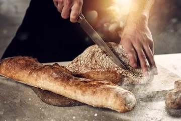 Fotobehang Baker with bread just out of the oven © alphaspirit