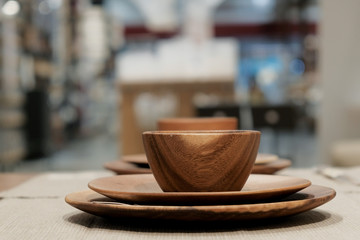 Wood bowl and wood plate in restaurant