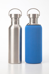 metal steel water flasks on white background. metal drinking utensils