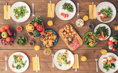 Big festive table with a huge amount of delicious, healthy food