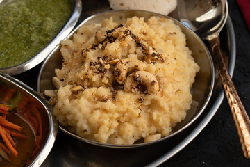 Pongal- South Indian rice and lentil porridge, spiced with black pepper, cumin, ginger, ghee and nuts