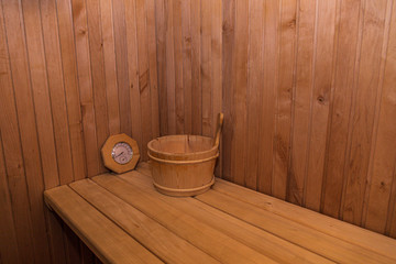 Fototapeta na wymiar Wooden sauna with traditional sauna accessories