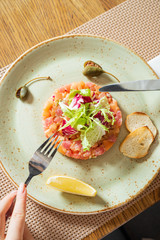 fish tartar with salad and lemon