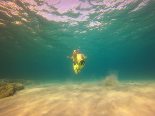 underwater man snorkeling in the sea withcrystal-clear waters concept of holiday relax summer beach diver in the sea