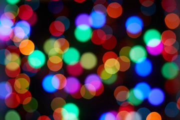Red and orange, green, blue bokeh. Abstract background. Dark background.