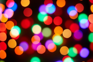 Red and orange, green, blue holiday bokeh. Abstract Christmas background
