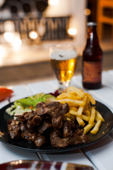 grilled steak with french fries and sauce