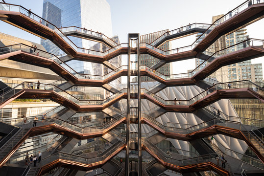 Honeycomb-like structure and elevator within The Vessel in Hudson Yards. Taken in New York City on October the 1st, 2019.