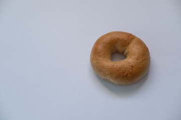 Bagel isolated on white background. Top view. Copy space.