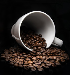 White cup with coffee beans