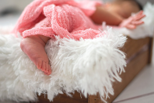 Closeup photo of a newborn foot while he is sleeping