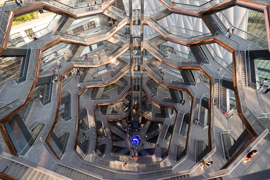 Honeycomb-like structure and elevator within The Vessel in Hudson Yards. Taken in New York City on October the 1st, 2019.