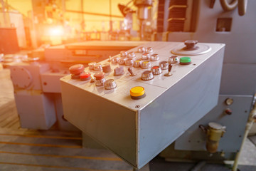 The remote control of a CNC machine for controlling mechanical processes in production.