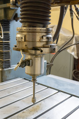 Abrasive grinding wheel on the spindle frame of a circular grinding machine.