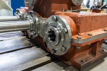 Gearbox assembly, spline shaft with bearing for transmitting the flywheel into motion.