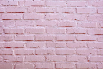 Painted brick wall in pink color. Texture.