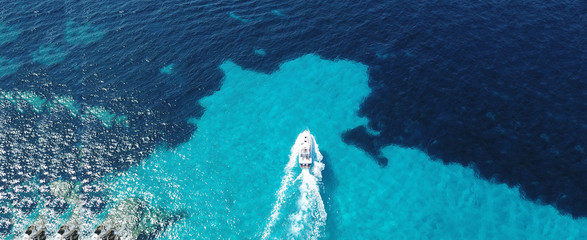 Aerial drone ultra wide photo of sailing yacht docked in paradise turquoise sea exotic island...