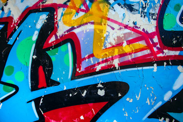 Closeup of damaged colorful urban wall texture. Modern pattern for wallpaper design. Creative urban...