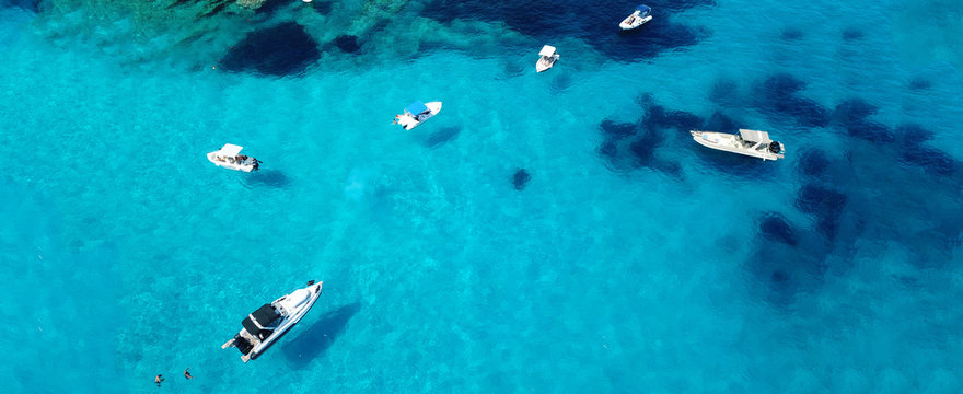 Aerial drone ultra wide photo of sailing yacht docked in paradise turquoise sea exotic island destination